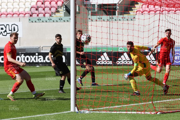 140622 - Wales U21 v Gibraltar U21, Under 21 European Championship Qualifying - Joe Adams of Wales beats Gibralta goalkeeper Jaylan Hankins to score the opening goal
