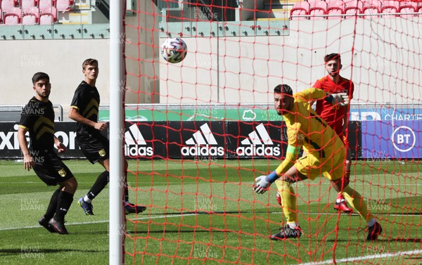 140622 - Wales U21 v Gibraltar U21, Under 21 European Championship Qualifying - Joe Adams of Wales beats Gibralta goalkeeper Jaylan Hankins to score the opening goal