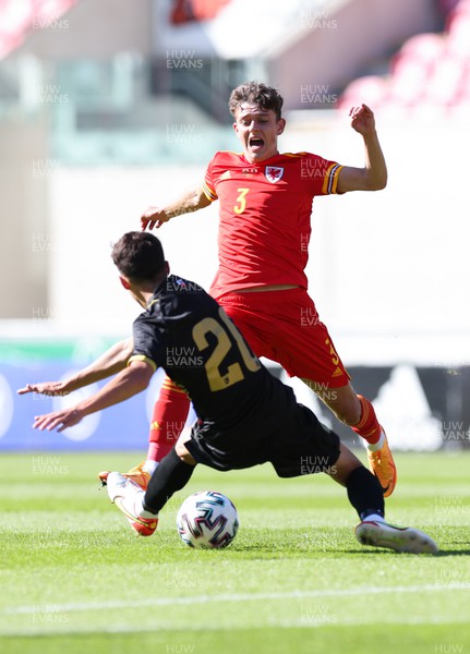 140622 - Wales U21 v Gibraltar U21, Under 21 European Championship Qualifying - Owen Beck of Wales is tackled by Nicholas Pozo of Gibraltar