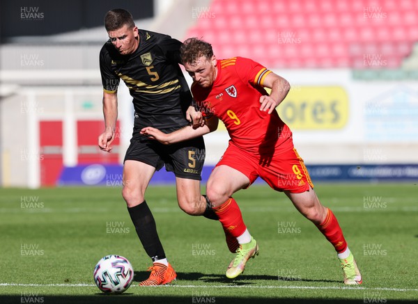 140622 - Wales U21 v Gibraltar U21, Under 21 European Championship Qualifying - Luke Jephcott of Wales takes on James Parkinson of Gibraltar