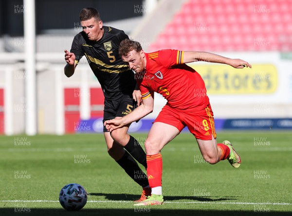 140622 - Wales U21 v Gibraltar U21, Under 21 European Championship Qualifying - Luke Jephcott of Wales takes on James Parkinson of Gibraltar