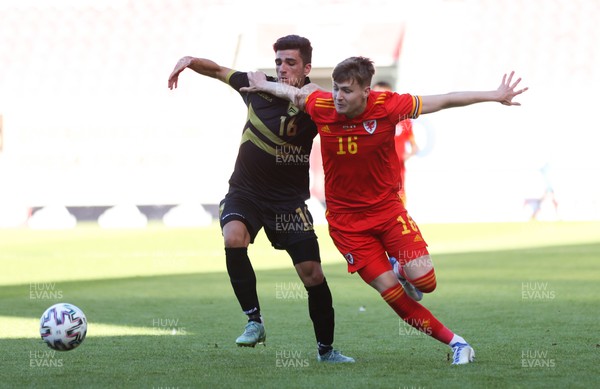 140622 - Wales U21 v Gibraltar U21, Under 21 European Championship Qualifying - Zac Ashworth of Wales holds off Michael Ruiz of Gibraltar