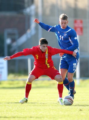 060213 - Wales v Iceland, Friendly Under 21 International, Llanelli - Wales' Kieron Freeman holds off Iceland's Kristjan Gauti Emilsson
