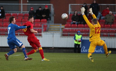 060213 - Wales v Iceland, Friendly Under 21 International, Llanelli - Wales' Wes Burns chips the ball over Iceland's Runar Alex Runarsson to score Wales's first goal