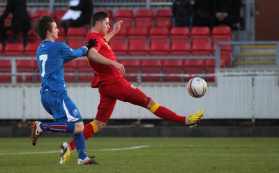 060213 - Wales v Iceland, Friendly Under 21 International, Llanelli - Wales' Wes Burns chips the ball over Iceland's Runar Alex Runarsson to score Wales's first goal