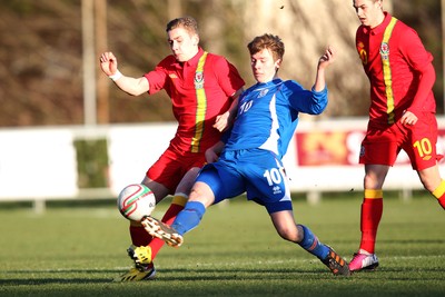060213 - Wales v Iceland, Friendly Under 21 International, Llanelli - Wales' Elliot Hewitt challenges Iceland's Emil Atlason for the ball