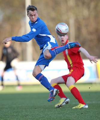 060213 - Wales v Iceland, Friendly Under 21 International, Llanelli - Iceland's Gudmundur Thorarinsson plays the ball as Wales' Elliot Hewitt looks on