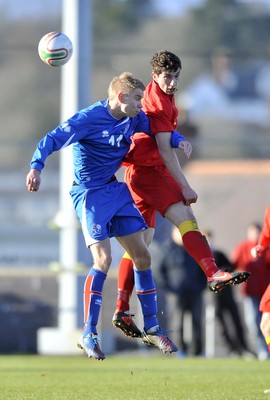 060213 - Wales v Iceland - Friendly U21 International  -  Joe Walsh of Wales', right, beats Iceland's Kristjan Gauti Emilsson in the air 