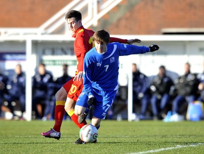 060213 - Wales v Iceland - Friendly U21 International  -  Tom Lawrence of Wales', left, is tackled by Iceland's Andri Rafn Yeoman 