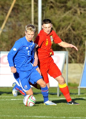 060213 - Wales v Iceland - Friendly U21 International  -  Iceland's Hordur Bjorgvin Magnusson, left, shields the ball from Jake Cassidy of Wales' 