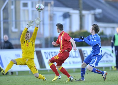 060213 - Wales v Iceland - Friendly U21 International  -  Wes Burns of Wales' chips Iceland's Arni Freyr Asgeirsosn to score the first goal 