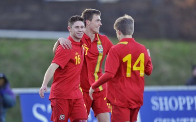 060213 - Wales v Iceland - Friendly U21 International  -  Wes Burns of Wales', left, celebrates his goal with Robert Ogleby and Lloyd Isgrove (14) 
