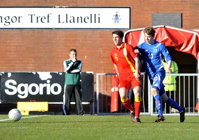 060213 - Wales v Iceland - Friendly U21 International  -  Joe Walsh of Wales, left, is tackled by Iceland's Emil Atalson 