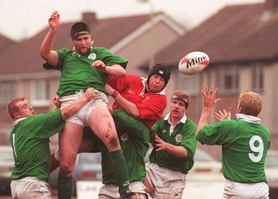 310197 - Wales U21s v Ireland U21s - Rory Sherriff of Ireland beats Neil Watkins to plan the ball to Stephen Bell