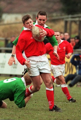 310197 - Wales U21s v Ireland U21s - Gareth Wyatt of Wales is tackled by Stephen Bell