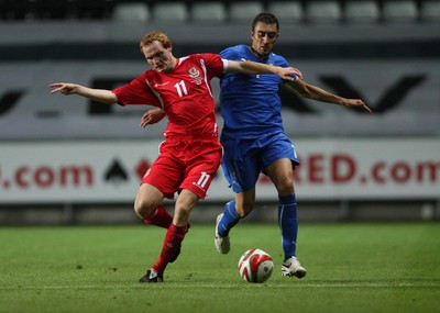 04.09.09 - Wales U21 v Italy U21, UEFA Under 21 Championship 2011 -  Wales' Shaun MacDonald is challenged by Italy's Tommaso Bianchi  