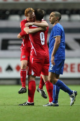 04.09.09 - Wales U21 v Italy U21, UEFA Under 21 Championship 2011 -  Wales' Shaun MacDonald celebrates with Sam Vokes at the end of the match as Italy's Giuseppe Bellusci walks off  