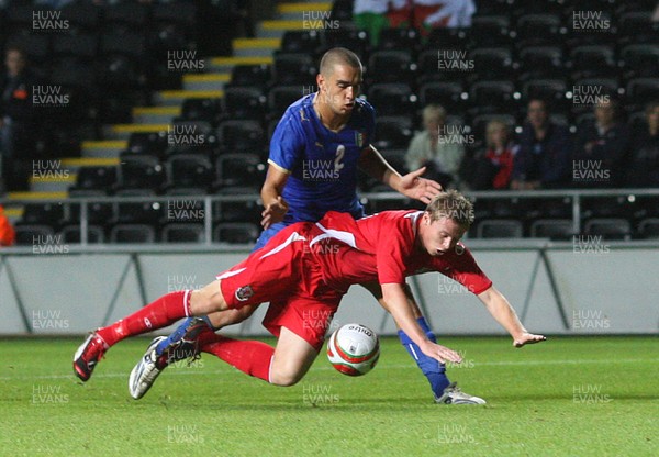 04.09.09 - Wales U21 v Italy U21, UEFA Under 21 Championship 2011 -  Wales' Simon Church is brought down by Italy's Giuseppe Bellusci  