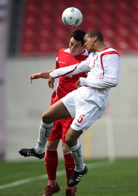 31.03.09 - Wales U21v Luxembourg U21, UEFA Under 21 Championship 2011, Llanelli -  Wales' Jonathan Brown  and Luxembourg's Gerard Seisbusch  battle for the ball 