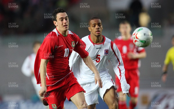 31.03.09 - Wales U21v Luxembourg U21, UEFA Under 21 Championship 2011, Llanelli -  Wales' Jonathan Brown  gets away from Luxembourg's Gerard Seisbusch   