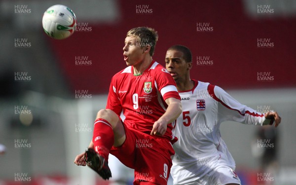 31.03.09 - Wales U21v Luxembourg U21, UEFA Under 21 Championship 2011, Llanelli -  Wales' Simon Church controls under pressure from Luxembourg's Gerard Seisbusch   