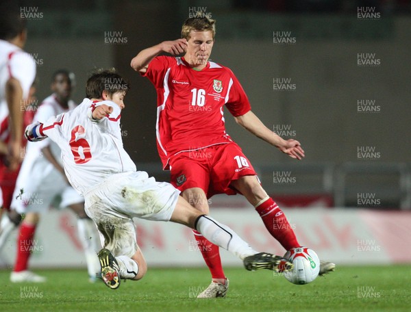 31.03.09 - Wales U21v Luxembourg U21, UEFA Under 21 Championship 2011, Llanelli -  Wales' Joe Partington is tackled by Luxembourg's Andy May  