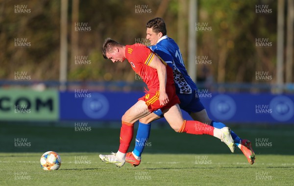 040621 - Wales U21 v Moldova U21, UEFA U21 EURO 2023 Qualifying Match - Edward Jones of Wales and Marius Iosipoi of Moldova compete for the ball