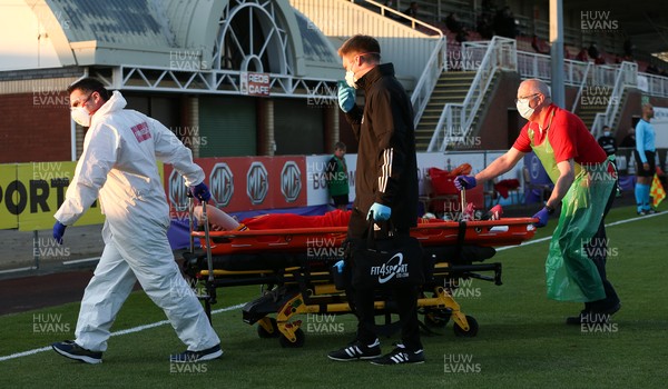 040621 - Wales U21 v Moldova U21, UEFA U21 EURO 2023 Qualifying Match - Sion Spence of Wales as he is stretchered off the pitch with an injury after picking up a red card for a second bookable offence