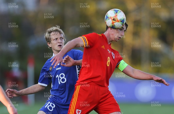 040621 - Wales U21 v Moldova U21, UEFA U21 EURO 2023 Qualifying Match - Terrence Taylor of Wales and Seraphim Cojocari of Moldova compete for the ball