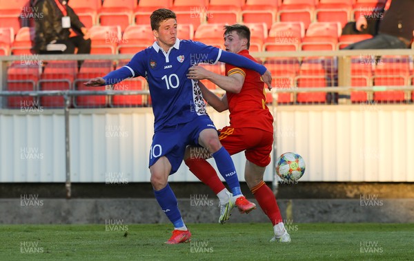 040621 - Wales U21 v Moldova U21, UEFA U21 EURO 2023 Qualifying Match - Edward Jones of Wales and Marius Iosipoi of Moldova compete for the ball