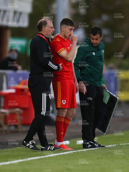 040621 - Wales U21 v Moldova U21, UEFA U21 EURO 2023 Qualifying Match - Wales U21 coach Paul Bodin with Lewis Collins of Wales as he comes on a substitute