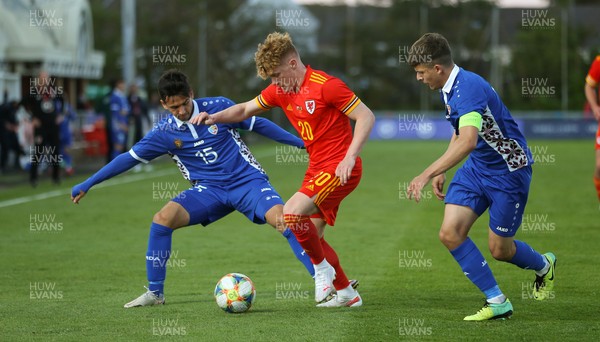 040621 - Wales U21 v Moldova U21, UEFA U21 EURO 2023 Qualifying Match - Sam Pearson of Wales takes on Dan Puscas of Moldova
