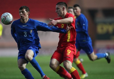 220313 - Wales U21 v Moldova U21 UEFA Championship Qualifying match, Llanelli - Wales' Jake Cassidy takes on Moldova's Maxim Focsa