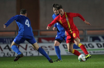 220313 - Wales U21 v Moldova U21 UEFA Championship Qualifying match, Llanelli - Wales' Emyr Huws takes on Moldova's Constantin Bogdan