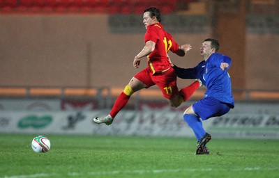 220313 - Wales U21 v Moldova U21 UEFA Championship Qualifying match, Llanelli - Wales' Billy Bodin tries to get past Moldova's Constantin Bogdan