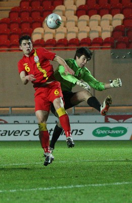 220313 - Wales U21 v Moldova U21 UEFA Championship Qualifying match, Llanelli - Wales' Joe Walsh and Moldova's keeper Alexi Koselev contest the ball