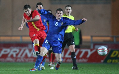 220313 - Wales U21 v Moldova U21 UEFA Championship Qualifying match, Llanelli - Wales' Robert Ogleby fires a shot at goal past Moldova's Vasile Jardan