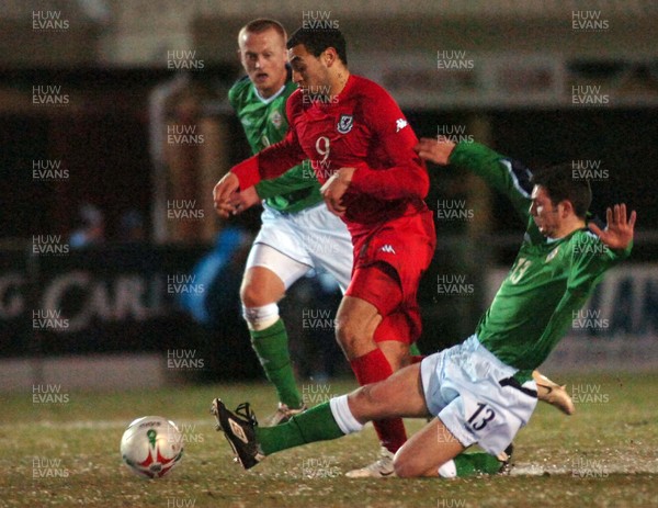 280206 - Wales U21 v Northern Ireland U21 - International Under 21 Challenge Match - Stebonheath Park, Llanelli - Wales' Craig Davies gets past Jim Ervin 