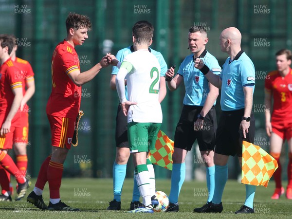 260321 - Wales U21 v Republic of Ireland U21 - International Friendly - Wales captain Terry Taylor and Ireland captain Lee O'Connor fist bump pre game at the coin toss