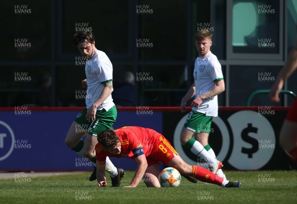 260321 - Wales U21 v Republic of Ireland U21 - International Friendly - Terry Taylor is fouled by Will Ferry