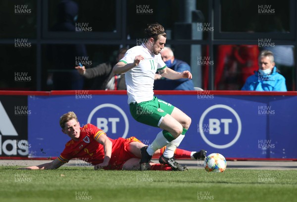 260321 - Wales U21 v Republic of Ireland U21 - International Friendly - Fin Stevens of Wales tackles Will Ferry