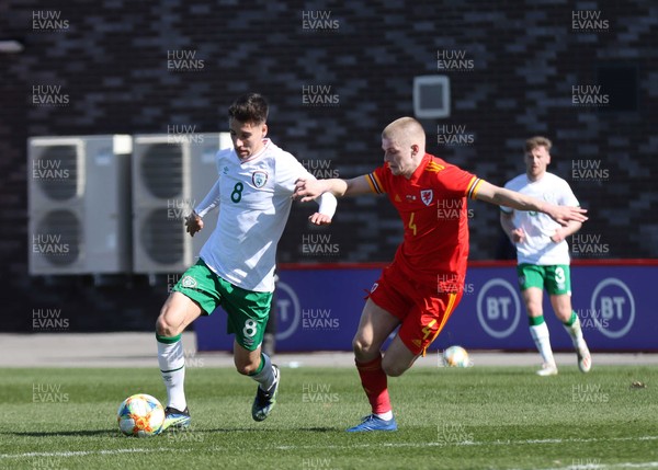 260321 - Wales U21 v Republic of Ireland U21 - International Friendly - Conor Noss of Ireland and Ryan Stirk