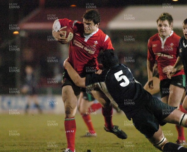 100206 - Wales U21 v Scotland U21 - Wales' Jamie Roberts is tackled by Ian Inmmo 