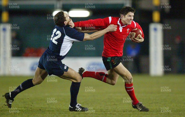 100206Wales v Scotland U21, Rodney Parade, Newport Wales' James Hook holds off Garry Law  