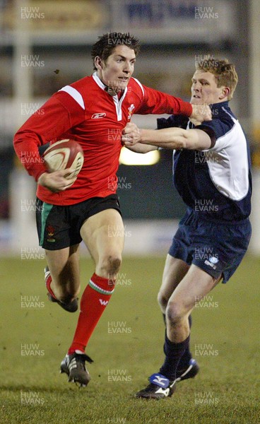 100206Wales v Scotland U21, Rodney Parade, Newport Wales' James Hook holds off Ben Addison  