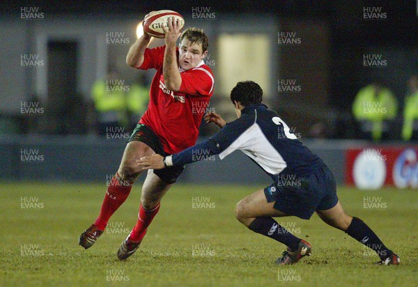 100206Wales v Scotland U21, Rodney Parade, Newport Wales' Rhys Shellard is tacjkled by Sean Crombie  