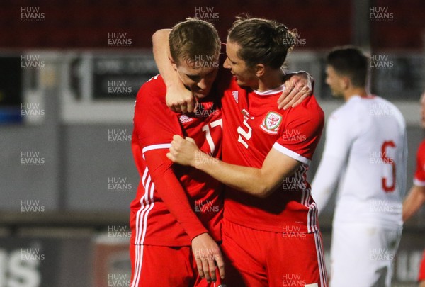 161018 - Wales U21 v Switzerland U21, European U21 Championship 2019 Qualifier - Connor Evans of Wales, left, is congratulated by Aaron Lewis of Wales after scoring the second goal