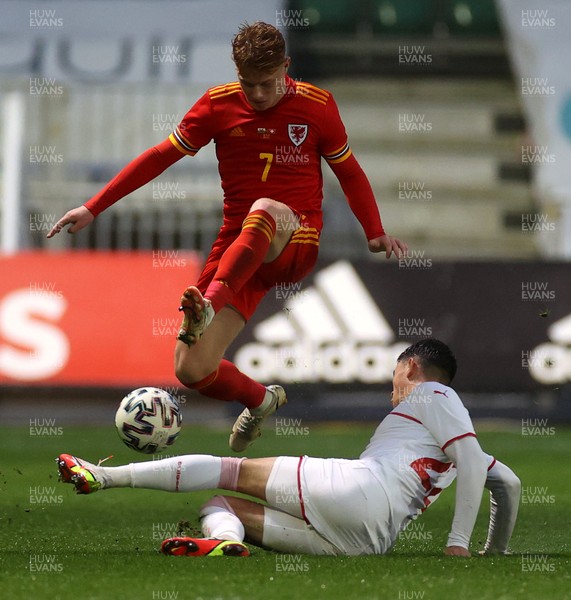 161121 - Wales U21 v Switzerland U21, European U21 Championship 2023 Qualifying Round - Samuel Pearson of Wales is tackled by Fabian Rieder of Switzerland