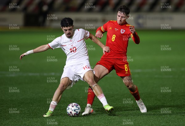 161121 - Wales U21 v Switzerland U21, European U21 Championship 2023 Qualifying Round - Terrence Taylor of Wales is tackled by Zeki Amdouni of Switzerland