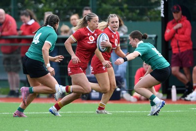 100526 - Wales U21 Women v Ireland U21 Women - Six Nations Women's U21 Series - Amy Williams of Wales Women is challenged by Katie Corrigan Ireland Women